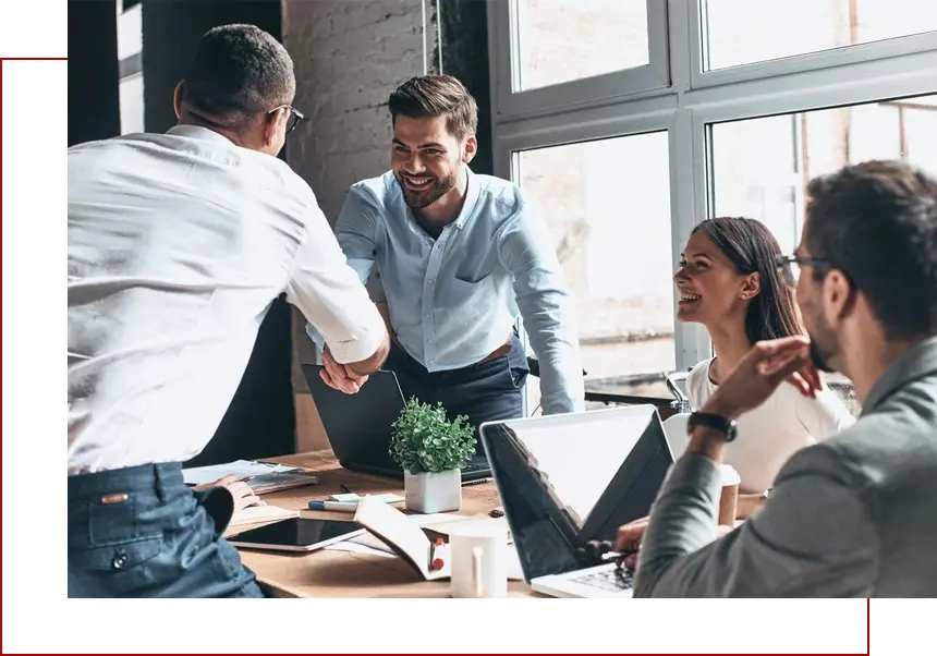 A group of people sitting around a table.