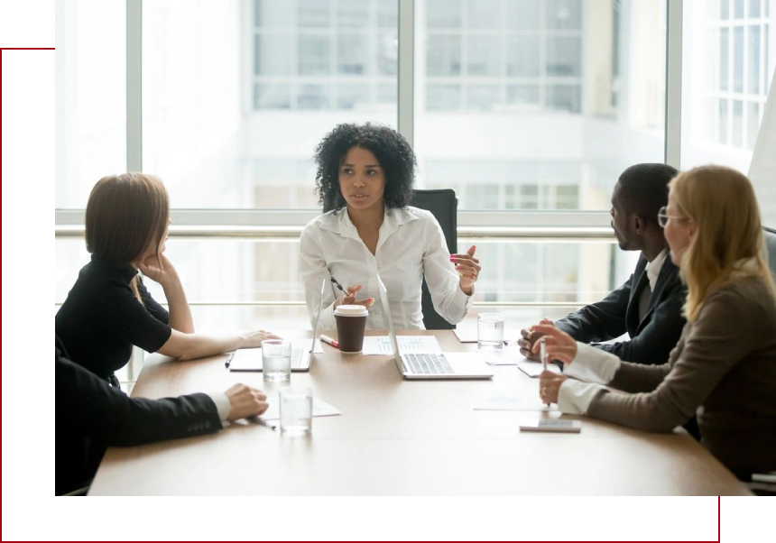 A group of people sitting at a table.